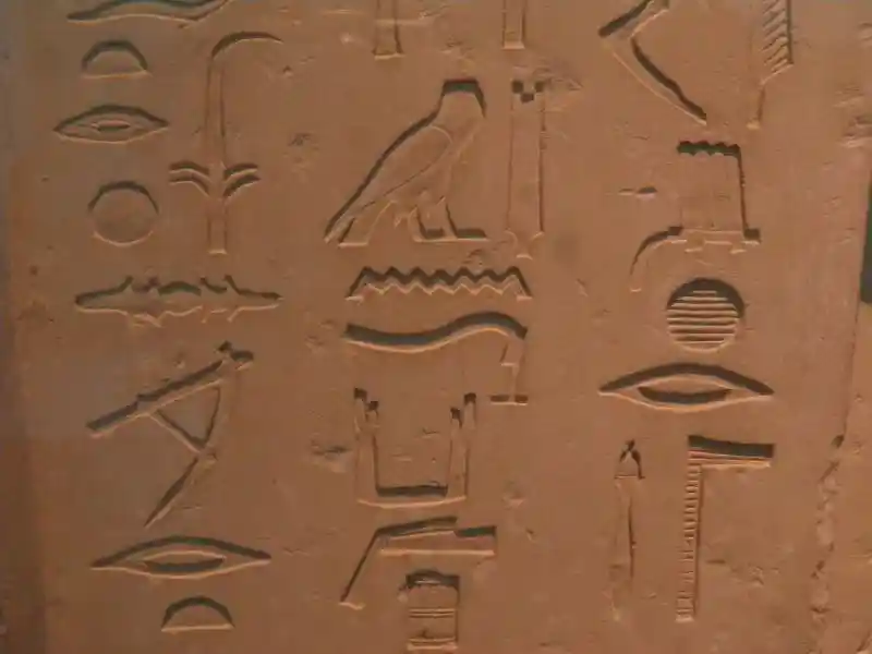 Bird, zigzag, solar disc and other symbols.